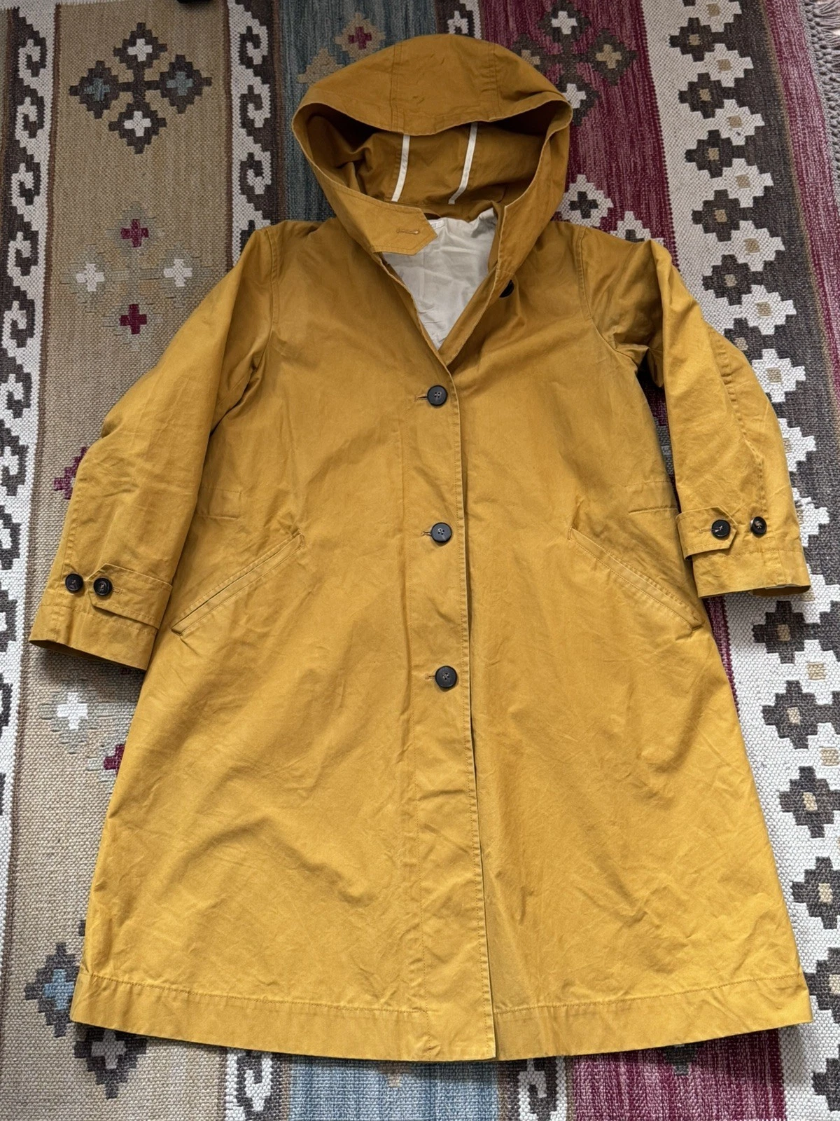 Toast Raincoat. Mustard Yellow, waterproof, size Medium/8 bit fits larger size
Opens in a new window