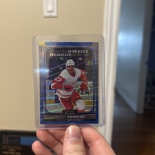 2021-22 OPC Platinum Marquee Rookies Lucas Raymond RC BLUE SURGE #286 Red Wings