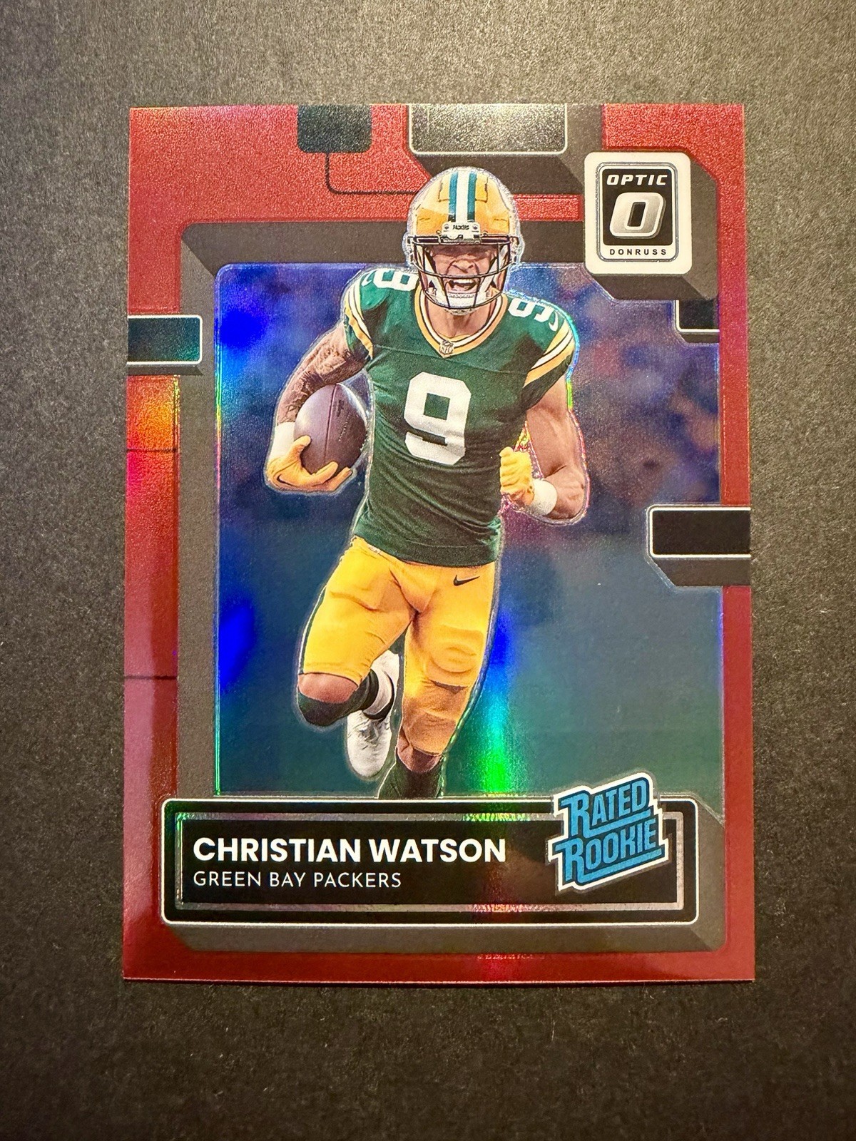 2022 Donruss Optic Christian Watson Rated Rookie Red Prizm /99 RC #219 PACKERS