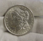 1887 O  US Morgan Dollar $1 AU (Cleaned).