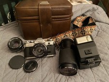 Vintage Canon AE-1 Bundle With Bag  50mm, 75-205mm, 35mm Lenses  Flash