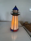 vintage Tiffany-style stained glass lighthouse accent table lamp.