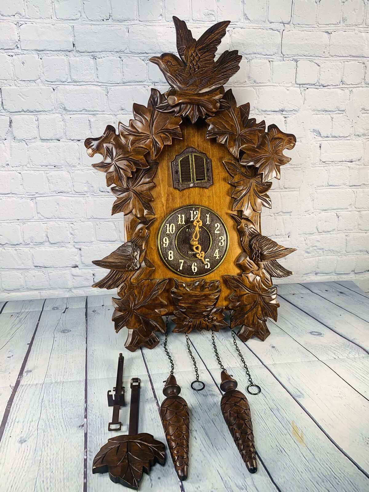 Kassel Walnut Six Leaves feeding Bird Nest Polished Wooden Cuckoo Clock