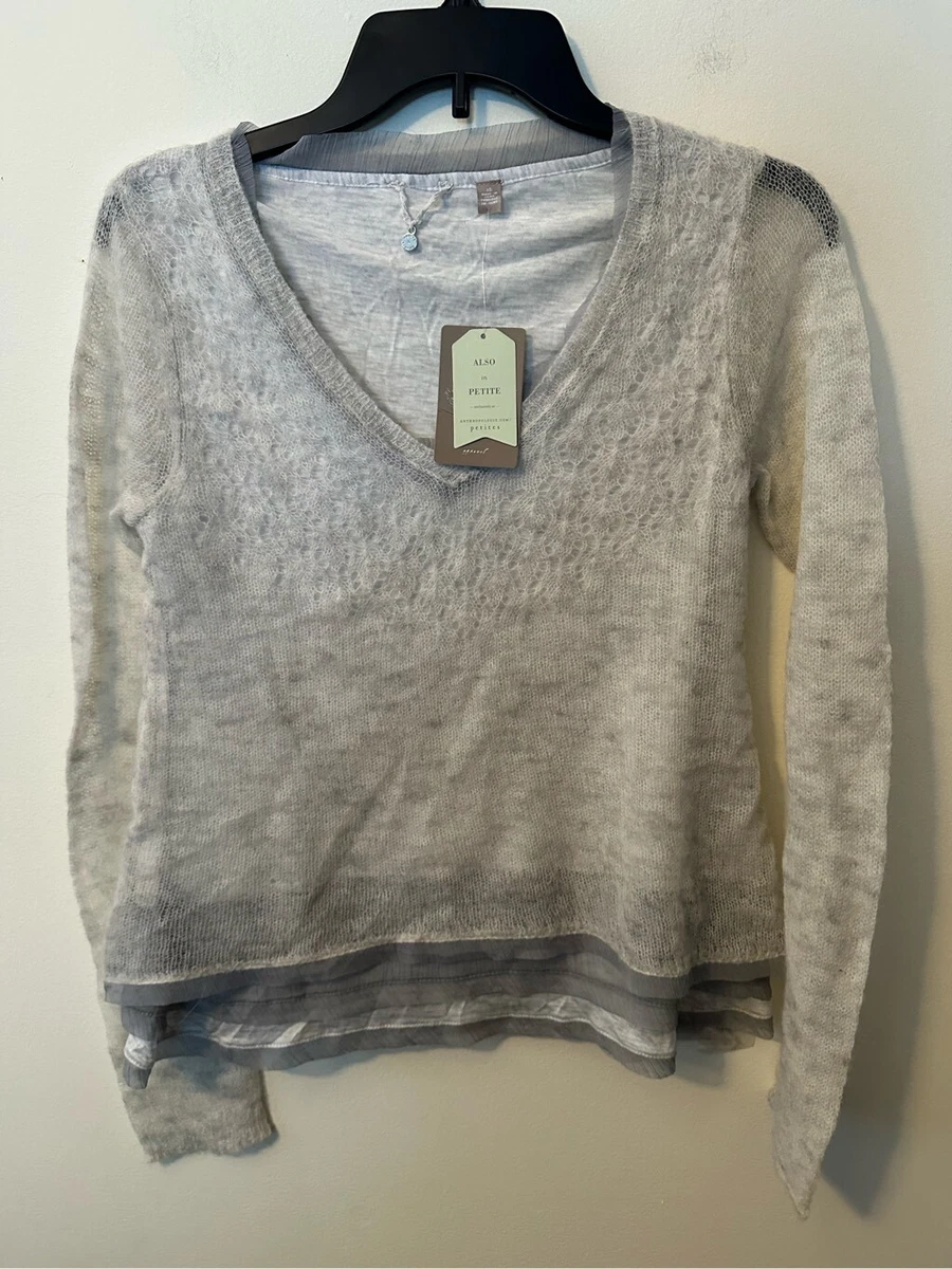 Knitted and top knotted sweater