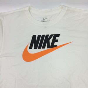 white nikes with orange swoosh