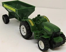Macfarm metal tractor and corn trailer.  418
