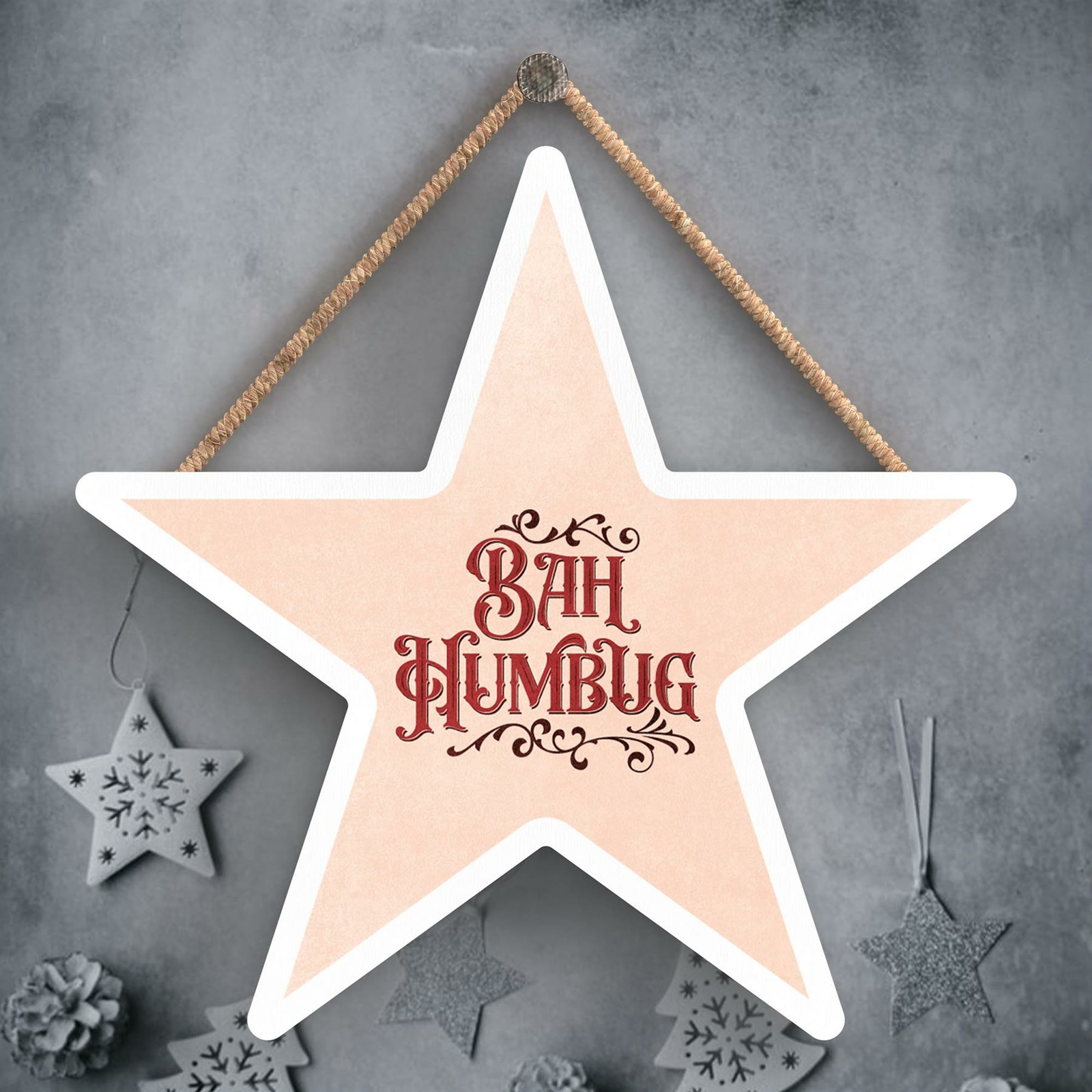 BAH HUMBUG PINK AND RED TYPOGRAPHY ON A STAR SHAPED WOODEN HANGING PLAQUE
