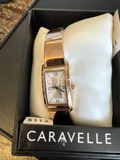 Ladies' Caravelle by Bulova Rose-Tone Bangle Watch with Rectangular Silver-Tone