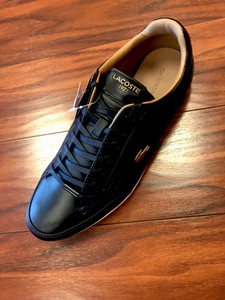 black and gold lacoste shoes