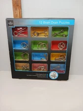 The Sharper Image 12 Brain Drain Puzzles Game In Original Box And Contents