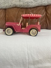 This item is a vintage Tonka Pink Surrey Jeep from the 1960s