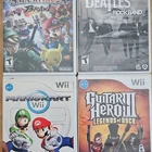 Nintendo Wii Game Lot: Guitar Hero III, Mario Kart, Smash Bros., Beatles Rock B…