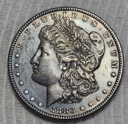 1883 P Morgan Silver Dollar. Estimated Uncirculated 63. Toner & Die Crack M0131.