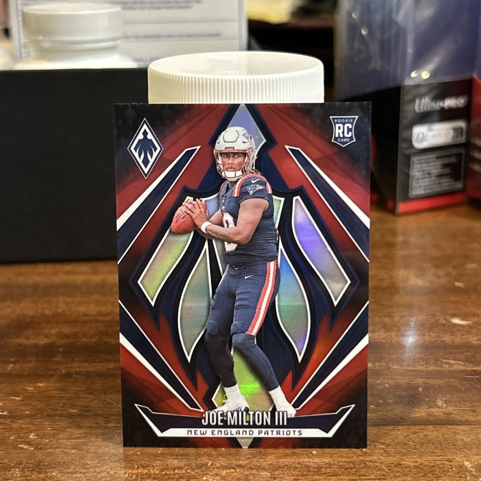 2024 Panini Phoenix Joe Milton #205 Red Fade /299 Patriots - Cowboys RC