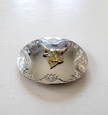 WESTERN VINTAGE CHROME AND GOLD MEN'S BELT BUCKLE BULL OVAL VERY GOOD CONDITION.