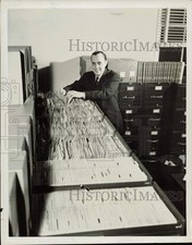 Press Photo Man Poses with House Un-American Activities Committee Files Press Photo Man Poses with House Un-American Activities Committee Files