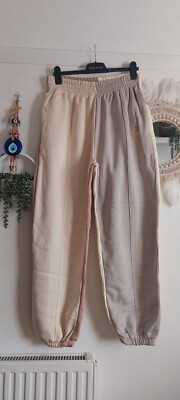 nike metallic swoosh colour block joggers in neutrals