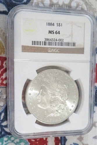 1884 - Morgan Silver Dollar - NGC - Sharp MS64 - VGC