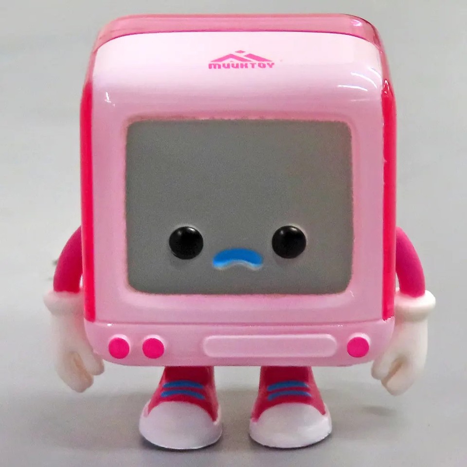 A pink skeleton in a retro PC Boy pose — bizarre, sculptural, and deeply niche in the best possible way for a desk or shelf.