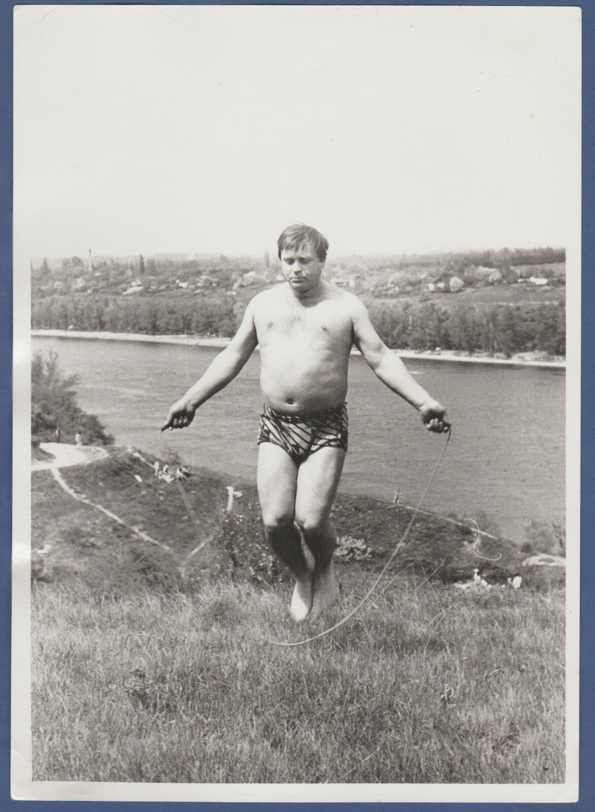 Shirtless guy jumping rope, naked torso, men's legs, trunks, Vintage