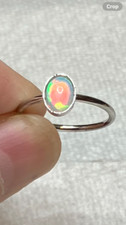  179B- .60ct Genuine Ethiopian Welo Opal set in a Size 8 Sterling Silver Ring