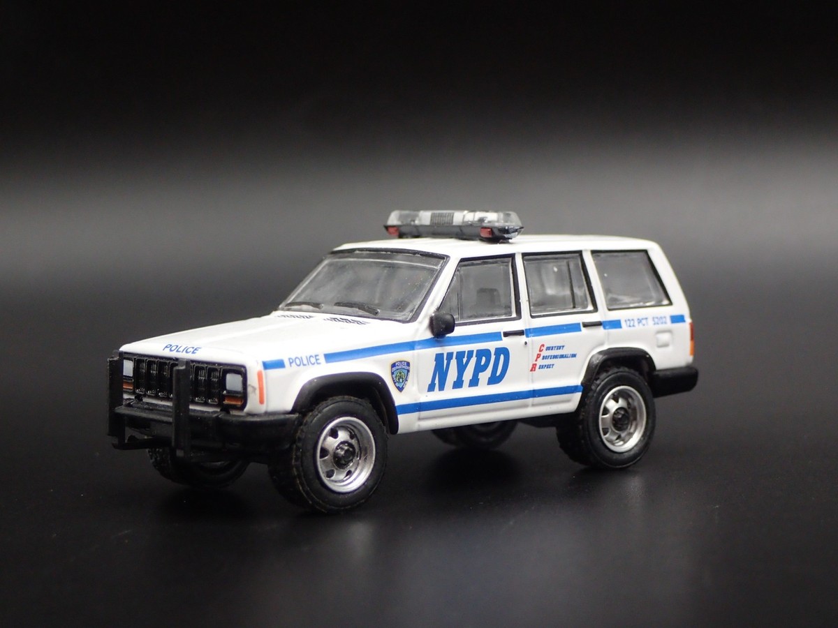 JEEP CHEROKEE XJ SPORT 4 DOOR NEW YORK NYPD POLICE 1:64 SCALE