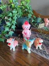 The Sun Rubber Company Squeaky Firefighter With Axe toy with Elephant and Hippos