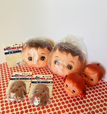 Lot of 6 Rubber Doll Heads, some in original packaging, some sleepy eyes hands
