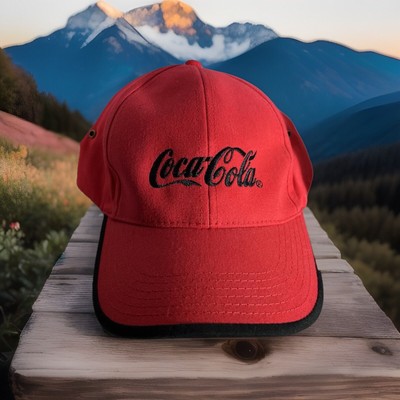 Red Coca-Cola hat with black trim and adjustable strap