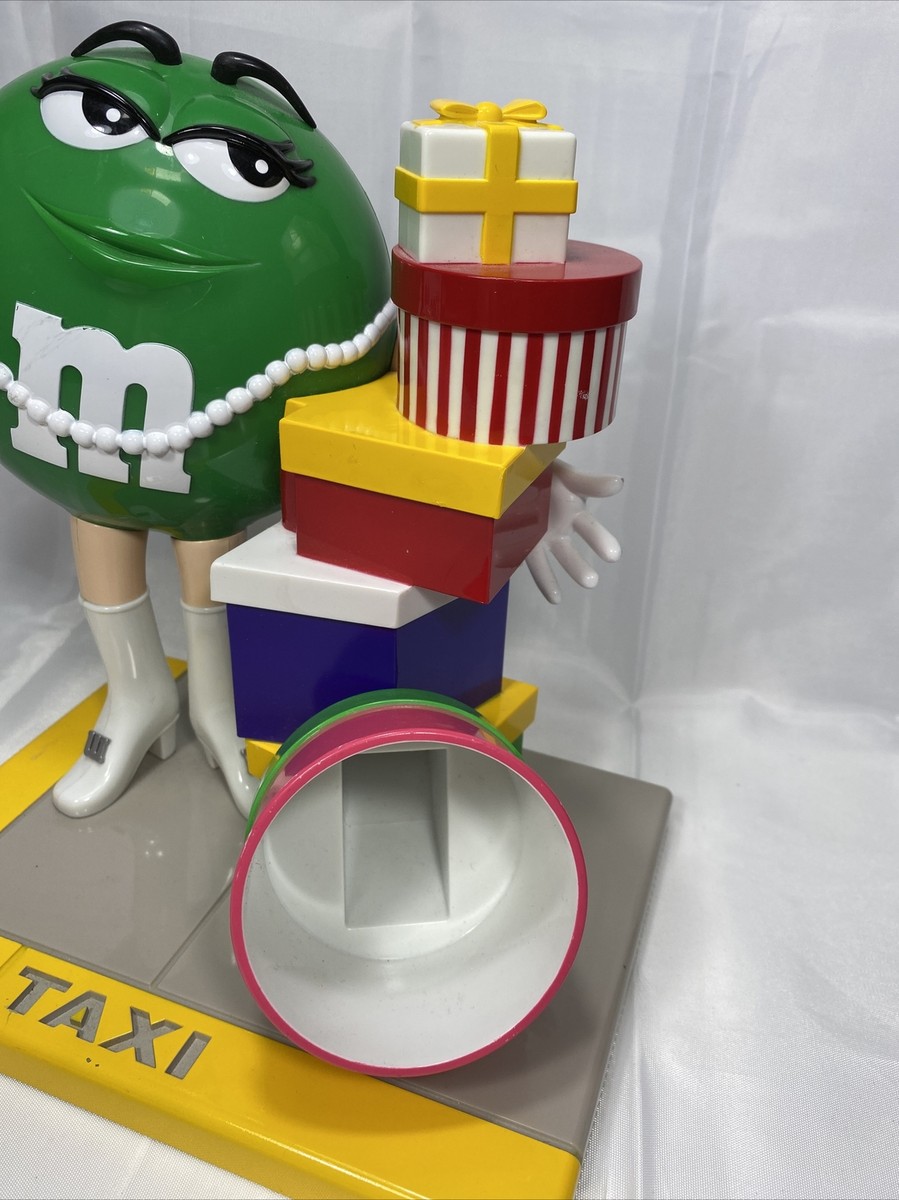 M&M's Ms. Green Girl M&M Taxi Stand with Gifts Presents Candy