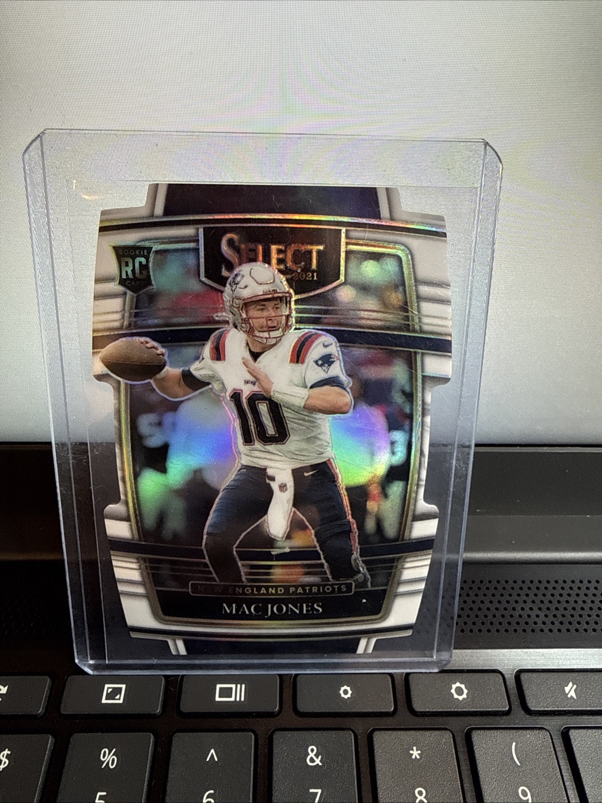 2021 Panini Select - Premier Level Mac Jones #151 White Prizm Die-Cut /99 (RC)