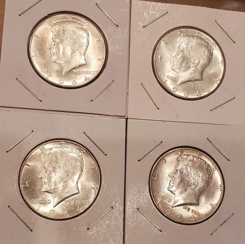 Four 1964 Kennedy half dollars
