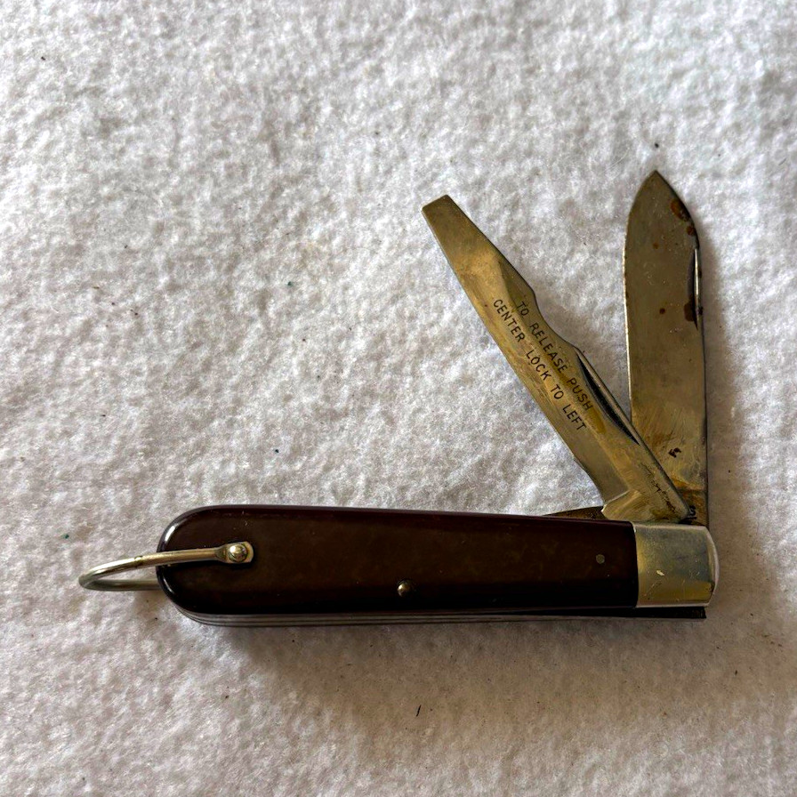 A USA-made Camillus TL-29 lineman's knife — a no-nonsense workhorse tool with serious heritage cred that looks great on a desk or in a pocket.