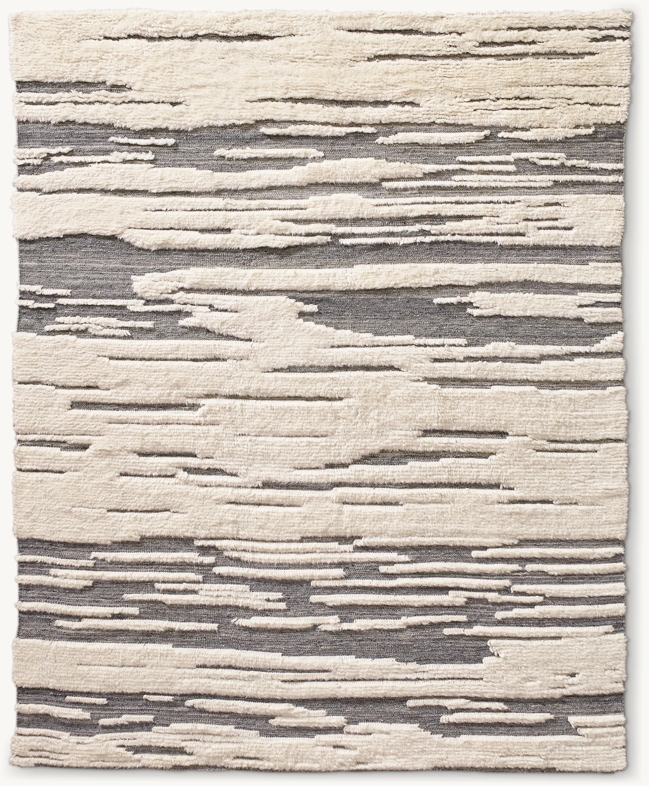 Rivulets of flatweave seem etched into our Tableau rug, creating pools Moroccan