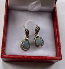 Rocks & Co 9ct white gold earrings. Lightning ridge black opal.