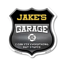 Jake's Garage I Can Fix Everything But Stupid Shield Shaped Sign Made in the USA