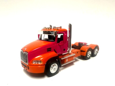 DCP / FIRST GEAR  1/64 SCALE  MACK PINNACLE DAY CAB, ORANGE & PINK
