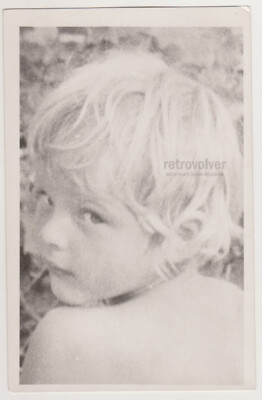Bright-eyed Blonde Boy in Close-Up Sweet Glimpse of Innocence Captured on Camera