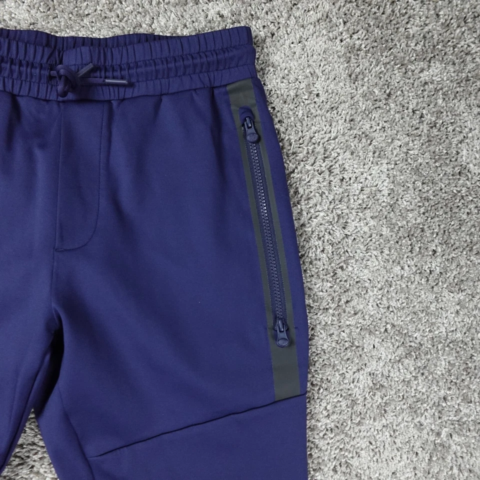 Pantalones de chándal Greyson para hombre pequeños azules rendimiento elásticos cónicos secuoya Foto 3 de 4