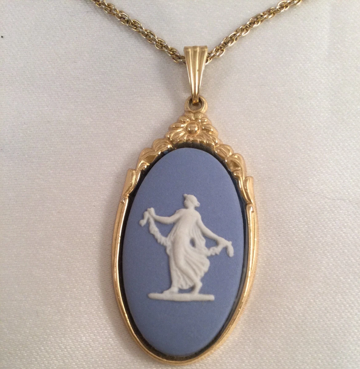 Gold necklace with blue pendant store