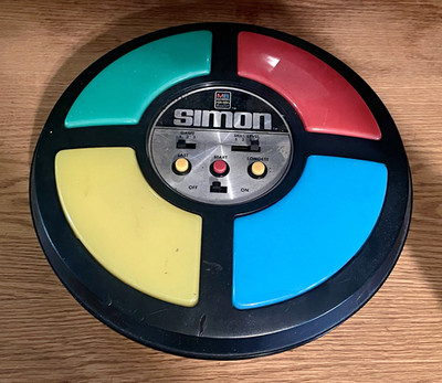 Milton Bradley Simon Handheld Electronic Memory Game Round 1978