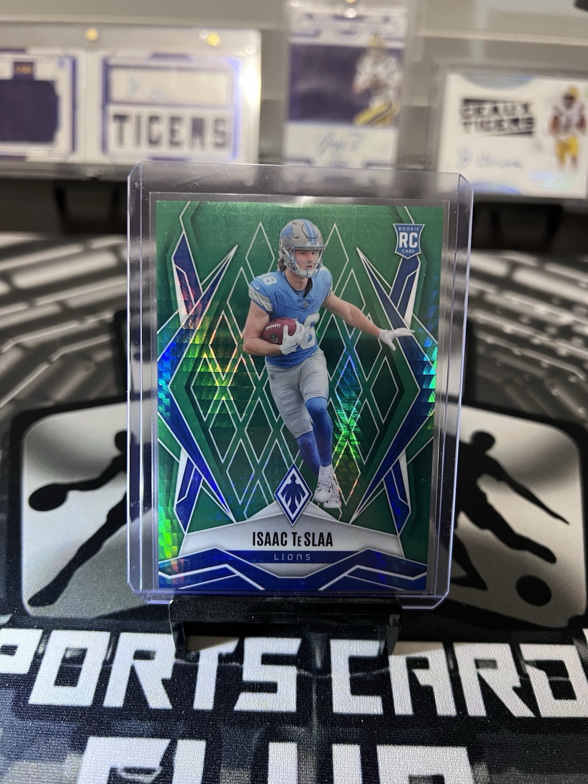 2025 Panini Phoenix - Rookies Isaac Teslaa #189 Green Hyper /149 (RC) Lions