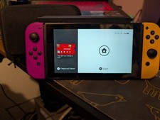 Nintendo Switch Console with Purple & Orange Joy-Con Controllers and Accessories