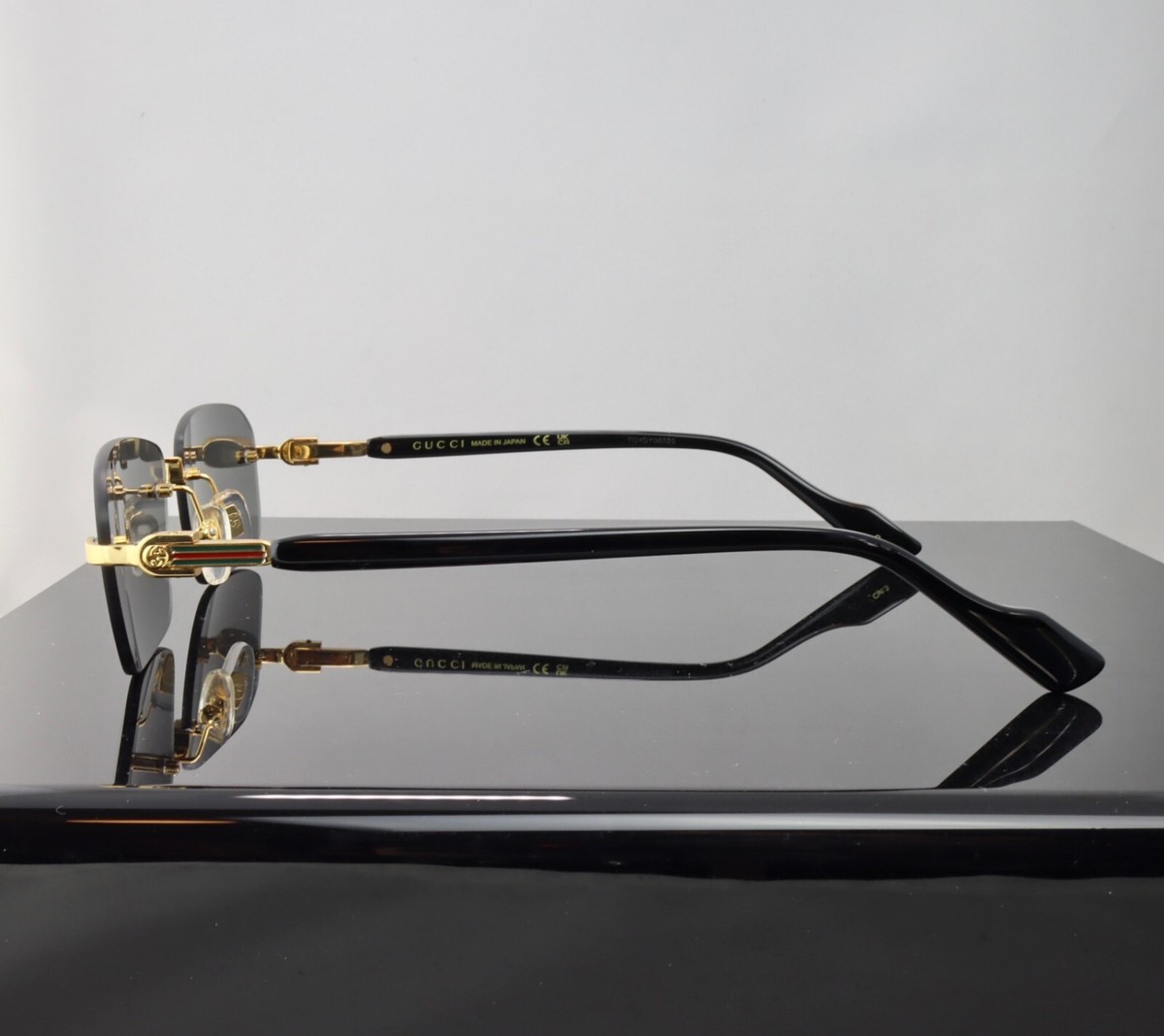 Gucci G1221S 001 Gold / Gray Lens Square Rimless Sunglasses 100