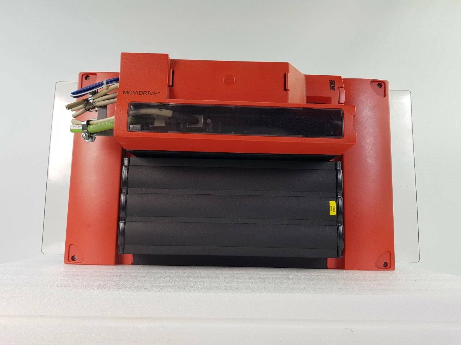 Front of the MOVIDRIVE B inverter with red end covers and wiring