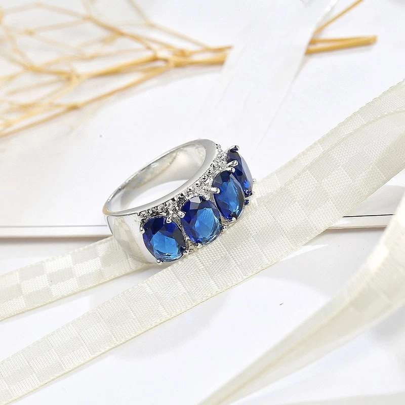 Alianza de piedra de circonita cúbica AAA de color azul para mujer anillo de boda relleno de oro blanco talla 6-10 Foto 4 de 4