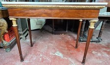 CONSOLE EN BOIS D'ACAJOU. STYLE EMPIRE. ENVELOPPE EN MARBRE. XIXÈME SIÈCLE.