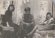 WW2 Photo of Soldier Seated With Two Women in Parlor