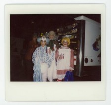 Kids in  HALLOWEEN COSTUME at food truck   vintage snapshot Polaroid color photo