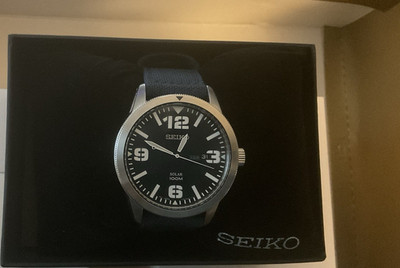 Seiko Solar Watch Mens Quartz 100m Date Black Dial Blue Nylon Strap Box